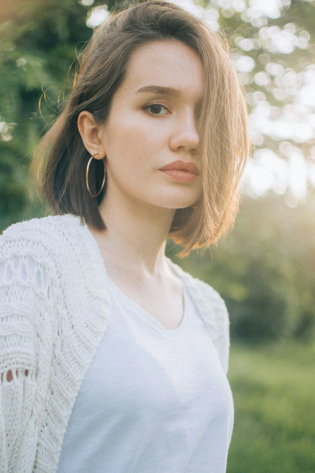 Woman wearing a light cardigan outdoors