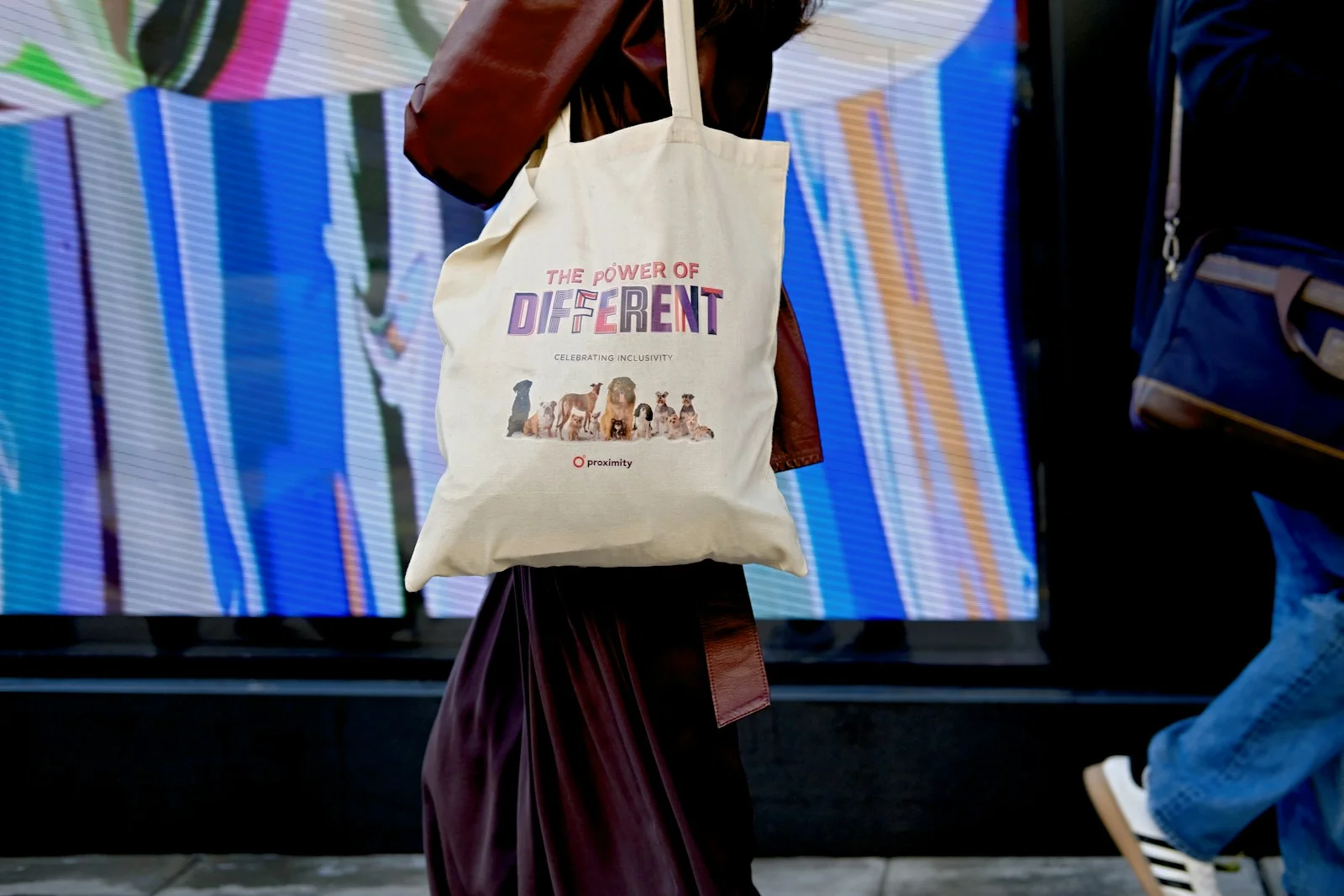 Woman holding a tote bag indoors